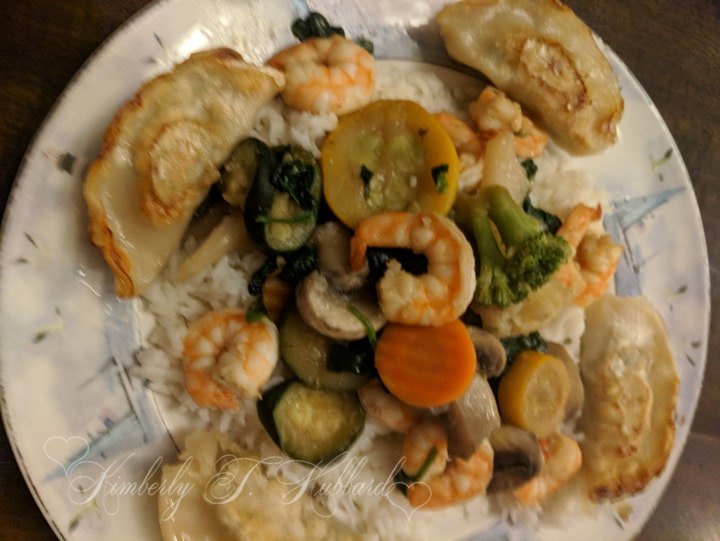 Served on a Bed of White Rice with Potstickers