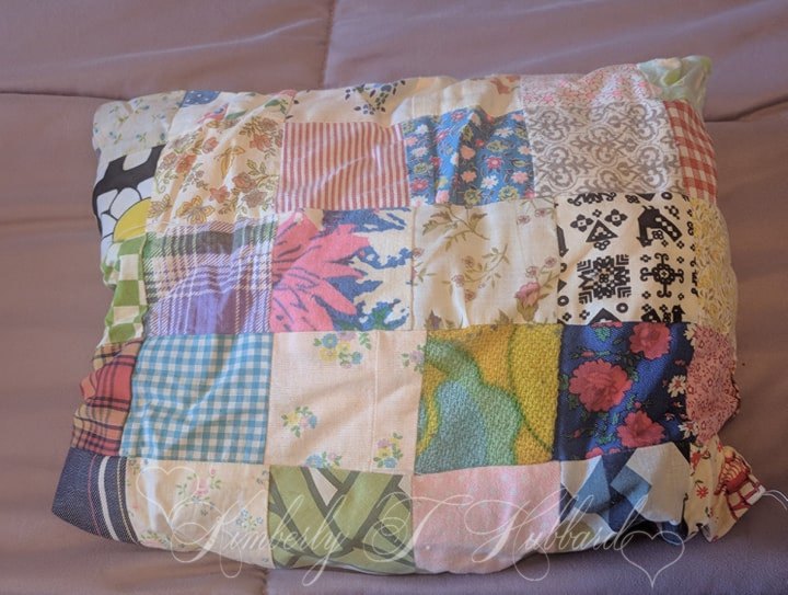 A Much Loved Pillow Made From Quilt Scraps