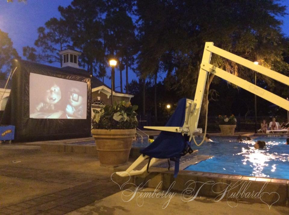 Watching Up on a Giant Inflatable Screen from the Pool Outside our Room